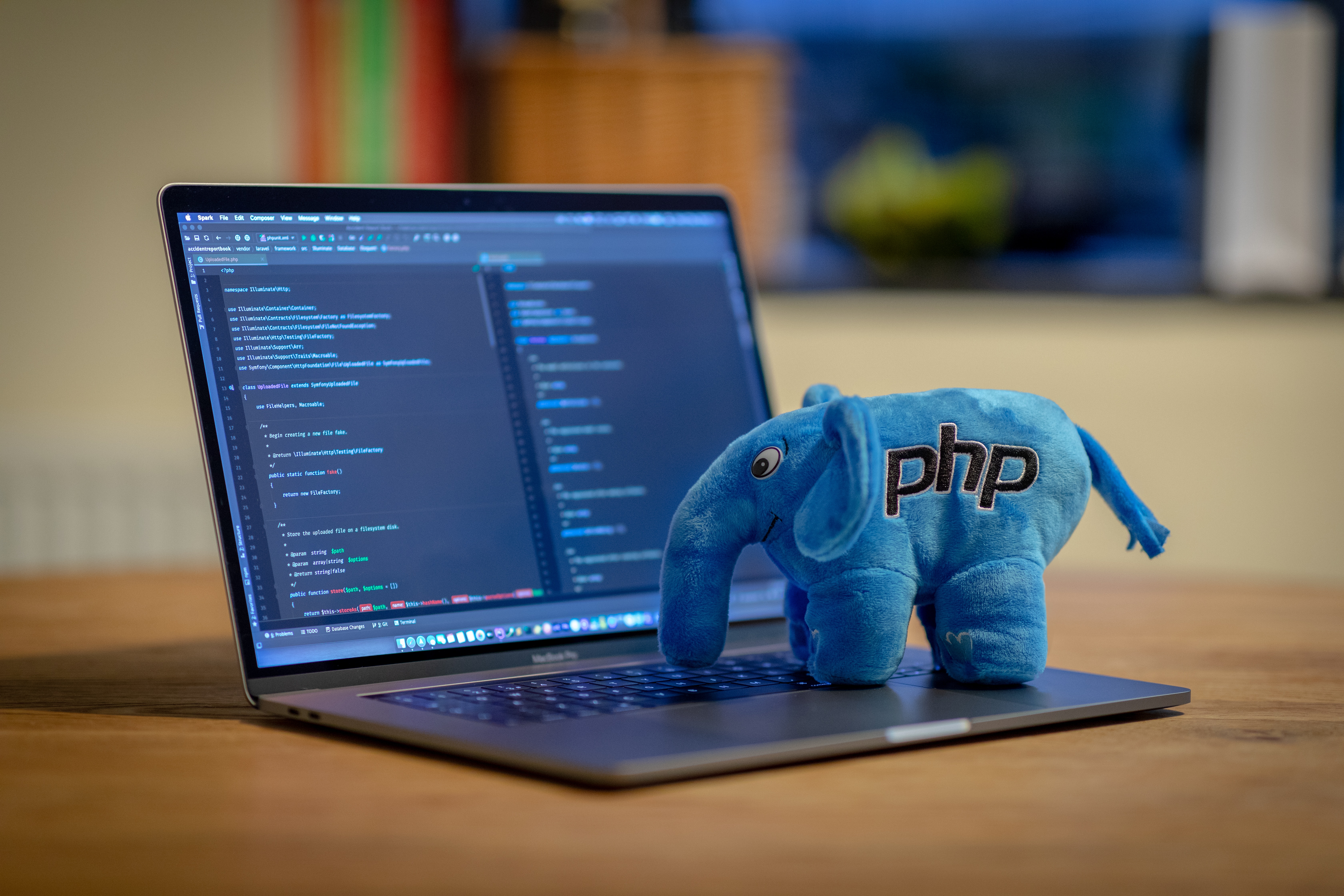 a php elephant mascot stuffie on a laptop computer
